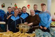 21 December 2016; Dublin manager Jim Gavin, centre, with Br. Kevin Crowley, and members of the Dublin backroom team, from left, Gerry Kelly, Tony Boylan, Mick Seavers and David Boylan and footballers Jonny Cooper and Con O'Callaghan, right, as they lend a hand packing some of the 3,000 Christmas parcels for the homeless at the Capuchin Day Centre on Bow Street, Dublin. Photo by Piaras Ó Mídheach/Sportsfile