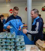 21 December 2016; Dublin football manager Jim Gavin and footballer Jonny Cooper as they lend a hand packing some of the 3,000 Christmas parcels for the homeless at the Capuchin Day Centre on Bow Street, Dublin. Photo by Piaras Ó Mídheach/Sportsfile