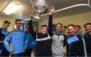 25 December 2016; Dublin manager Jim Gavin,  team captain Stephen Cluxton, and team members James McCarthy, and Ciaran Kilkenny look on as Joe Tuohy, 14 years, from Castlebar Mitchells, lifts the Sam Maguire Cup during a visit by the Dublin players to Beaumont Hospital in Beaumount, Dublin. Joe was in the hopspital to visit his sister Lucy who is a patient.  Photo by Ray McManus/Sportsfile