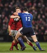 26 December 2016; Rory Scannell of Munster is tackled by Robbie Henshaw of Leinster during the Guinness PRO12 Round 11 match between Munster and Leinster at Thomond Park in Limerick. Photo by Brendan Moran/Sportsfile