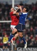 26 December 2016; Andrew Conway of Munster wins possession ahead of Isa Nacewa of Leinster during the Guinness PRO12 Round 11 match between Munster and Leinster at Thomond Park in Limerick. Photo by Diarmuid Greene/Sportsfile