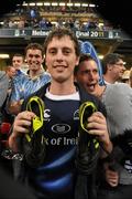 21 May 2011; Leinster supporter Kevin O'Hara, from Kilcock, Co. Kildare, centre, who had thrown his hat to Leinster's Brian O'Driscoll who in turn removed his boots and threw them to Kevin. Heineken Cup Final, Leinster v Northampton Saints, Millennium Stadium, Cardiff, Wales. Picture credit: Ray McManus / SPORTSFILE