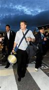 21 May 2011; Jamie Heaslip carries the cup in Cardiff Airport after Leinster's Heineken Cup Final victory over Northampton Saints. Cardiff Airport, Wales. Picture credit: Ray McManus / SPORTSFILE