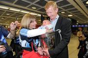 21 May 2011; Leinster's Leo Cullen with the Heineken Cup trophy and his nephew, 8 week old Fionn Quilter, on arriving home at Dublin Airport following their side's Heineken Cup Final victory over Northampton Saints. Dublin Airport, Dublin. Picture credit: Pat Murphy / SPORTSFILE
