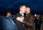 21 May 2011; Leinster captain Leo Cullen is congratulated by former Leinster,Toulouse and Ireland star Trevor Brennan in Cardiff Airport after Leinster's Heineken Cup Final victory over Northampton Saints. Cardiff Airport, Wales. Picture credit: Ray McManus / SPORTSFILE