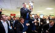 21 May 2011; RTÉ broadcaster Pat Kenny is carried shoulder high by Paul O'Donohoe and Shane Horgan in Cardiff Airport after Leinster's Heineken Cup Final victory over Northampton Saints. Cardiff Airport, Wales. Picture credit: Ray McManus / SPORTSFILE