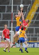 22 May 2011; Pearse O'Neill, Cork, supported by team-mate Aidan Walsh, left, contests a high ball with Ger Quinlan, Clare, supported by team-mate Martin McMahon. Munster GAA Football Senior Championship Quarter-Final, Cork v Clare, Pairc Ui Chaoimh, Cork. Picture credit: Pat Murphy / SPORTSFILE