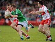 22 May 2011; John Woods, Fermanagh, in action against Emmett McGuckian and Eoin Bradley, right, Derry. Ulster GAA Football Senior Championship Quarter-Final, Derry v Fermanagh, Celtic Park, Derry. Picture credit: Oliver McVeigh / SPORTSFILE