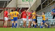 22 May 2011; Graham Kelly, Clare, second from right, headbutts Cork's John Miskella after being shown the red card by referee Eddie Kinsella. Munster GAA Football Senior Championship Quarter-Final, Cork v Clare, Pairc Ui Chaoimh, Cork. Picture credit: Pat Murphy / SPORTSFILE