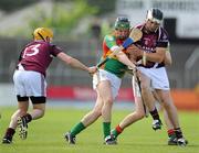22 May 2011; John Rogers, supported by Eoin Nolan, Carlow, in action against Dan Carthy, left, and Paul Greyville, Westmeath. Leinster GAA Hurling Senior Championship First Round, Carlow v Westmeath, Dr. Cullen Park, Carlow. Picture credit: Ray McManus / SPORTSFILE