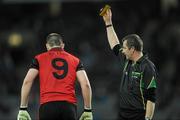 2 April 2011; Kalum King, Down, is shown the notebook by referee Syl Doyle. Allianz Football League Division 1 Round 6, Dublin v Down, Croke Park, Dublin. Picture credit: Ray McManus / SPORTSFILE