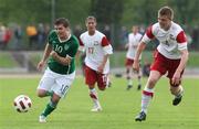 24 May 2011; Connor Murphy, Republic of Ireland, and Mariusz Mikoda, 4, Poland, chase down a loose ball. UEFA Under 19 Championship Elite Round, Republic of Ireland v Poland, Baltyk Koszalin, Koszalin, Poland. Picture credit: Lukasz Grochala / SPORTSFILE