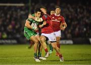 31 December 2016; Tiernan O’Halloran of Connacht is tackled by Andrew Conway of Munster during the Guinness PRO12 Round 12 match between Connacht and Munster at Sportsground in Galway. Photo by Brendan Moran/Sportsfile