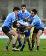 1 January 2017; Stephen Smith of Dubs Stars in action against Dublin players, from left, Conor Mullally, Ross McGowan and Niall Scully during the Football Challenge game between Dublin and Dubs Stars at Parnell Park in Dublin. Photo by David Maher/Sportsfile