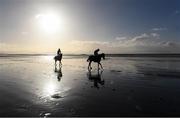 1 January 2017; Horses and jockeys leave the course after a race during the Ballyheigue Races on Ballyheigue beach on the edge of the North Atlantic ocean in Co. Kerry. Photo by Brendan Moran/Sportsfile