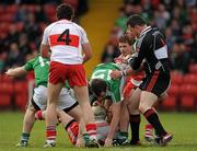 22 May 2011; Kevin McCloy, Derry, holds onto the ball despite the attentions of Tomas Corrigan and Sean Quigley, Fermanagh. Ulster GAA Football Senior Championship Quarter-Final, Derry v Fermanagh, Celtic Park, Derry. Picture credit: Oliver McVeigh / SPORTSFILE