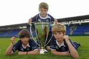 25 May 2011; Pictured at the launch of Volkwagen Leinster Rugby Summer Camps are Leinster supporters and cousins, from left, James Durkan-Watson, age 11, Old Belvedere, Neil Durkan, age 11, Greystones and John Durkan, Age 11, Stradbrook. Leinster players Isa Nacewa, Richardt Strauss and Eoin Reddan, along with the Heineken Cup Trophy, were on hand today to launch the Volkswagen Leinster Rugby Summer Camps which will run throughout the province in July and August. Players will be taught the basic skills of the game by fully accredited IRFU coaches and they will also have the chance to meet their heroes with two senior Leinster players expected to visit each camp along with the Heineken Cup. For a full list of venues or to book a place please log on to www.leinsterrugby.ie/summercamps. Donnybrook Stadium, Donnybrook, Dublin. Picture credit: Pat Murphy / SPORTSFILE
