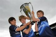 25 May 2011; Pictured at the launch of Volkswagen Leinster Rugby Summer Camps are Leinster supporters and cousins, from left, James Durkan-Watson, age 11, Old Belvedere, John Durkan, Age 11, Stradbrook, and Neil Durkan, age 11, Greystones. Leinster players Isa Nacewa, Richardt Strauss and Eoin Reddan, along with the Heineken Cup Trophy, were on hand today to launch the Volkswagen Leinster Rugby Summer Camps which will run throughout the province in July and August. Players will be taught the basic skills of the game by fully accredited IRFU coaches and they will also have the chance to meet their heroes with two senior Leinster players expected to visit each camp along with the Heineken Cup. For a full list of venues or to book a place please log on to www.leinsterrugby.ie/summercamps. Donnybrook Stadium, Donnybrook, Dublin. Picture credit: Pat Murphy / SPORTSFILE