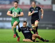 7 January 2016; John Cooney of Connacht is tackled by Ashley Beck of Ospreys during the Guinness PRO12 Round 13 match between Ospreys and Connacht at Liberty Stadium in Swansea, Wales. Photo by Chris Fairweather/Sportsfile