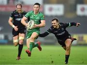 7 January 2016; John Cooney of Connacht is tackled by Ashley Beck of Ospreys during the Guinness PRO12 Round 13 match between Ospreys and Connacht at Liberty Stadium  in Swansea, Wales. Photo by Chris Fairweather/Sportsfile