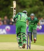 28 May 2011; Alex Cusack, Ireland, has his stumps removed by Junaid Khan, Pakistan. RSA ODI Series, Ireland v Pakistan, Stormont, Belfast, Co. Antrim. Picture credit: Oliver McVeigh / SPORTSFILE