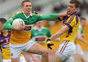 28 May 2011; Anton Sullivan, Offaly, in action against Adrian Flynn, Wexford. Leinster GAA Football Senior Championship First Round, Wexford v Offaly, O'Connor Park, Tullamore, Co. Offaly. Picture credit: Pat Murphy / SPORTSFILE