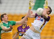 28 May 2011; Anthony Masterson, Wexford, in action against Ciaran McManus, Offaly. Leinster GAA Football Senior Championship First Round, Wexford v Offaly, O'Connor Park, Tullamore, Co. Offaly. Picture credit: Pat Murphy / SPORTSFILE