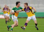 28 May 2011; Richard Dalton, Offaly, in action against Adrian Flynn, Wexford. Leinster GAA Football Senior Championship First Round, Wexford v Offaly, O'Connor Park, Tullamore, Co. Offaly. Picture credit: Pat Murphy / SPORTSFILE