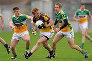 28 May 2011; Eric Bradley, Wexford, in action against Nigel Dunne, left, and Stehen Lonergan, Offaly. Leinster GAA Football Senior Championship First Round, Wexford v Offaly, O'Connor Park, Tullamore, Co. Offaly. Picture credit: Pat Murphy / SPORTSFILE