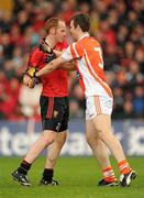 28 May 2011; Brendan Coulter, Down, and Armagh full-back Brendan Donaghy, become involved in a bit of pushing and shoving. Ulster GAA Football Senior Championship Quarter-Final, Armagh v Down, Morgan Athletic Grounds, Armagh. Picture credit: Ray McManus / SPORTSFILE