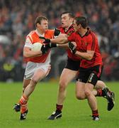 28 May 2011; Kieran Toner, Armagh, in action against Kalum King, left, and Peter Fitzpatrick, Down. Ulster GAA Football Senior Championship Quarter-Final, Armagh v Down, Morgan Athletic Grounds, Armagh. Picture credit: Oliver McVeigh / SPORTSFILE