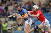 29 May 2011; Thomas Stapleton, Tipperary, in action against Brian Lawton, Cork. Munster GAA Hurling Intermediate Championship, Quarter-Final, Tipperary v Cork, Semple Stadium Thurles, Co. Tipperary. Picture credit: Ray McManus / SPORTSFILE