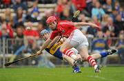 29 May 2011; John O'Brien, Tipperary, in action against Shane O'Neill, Cork. Munster GAA Hurling Senior Championship, Quarter-Final, Tipperary v Cork, Semple Stadium Thurles, Co. Tipperary. Picture credit: Stephen McCarthy / SPORTSFILE