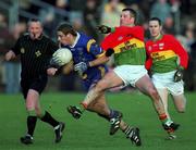 20 January 2002; Barry O'Donavan of Wicklow is tackled by Johnny Kavanagh of Carlow during the O'Byrne Cup final match between Carlow and Wicklow at Dr Cullen Park in Carlow. Photo by Damien Eagers/Sportsfile