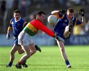 20 January 2002; Thomas Burke of Wicklow in action against John Hickey of Carlow during the O'Byrne Cup final match between Carlow and Wicklow at Dr Cullen Park in Carlow. Photo by Damien Eagers/Sportsfile