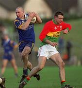 20 January 2002; Adrian Foley of Wicklow in action against Sean Kavanagh of Carlow during the O'Byrne Cup final match between Carlow and Wicklow at Dr Cullen Park in Carlow. Photo by Damien Eagers/Sportsfile