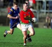 20 January 2002; Johnny Kavanagh of Carlow in action against Thomas Burke of Wicklow during the O'Byrne Cup final match between Carlow and Wicklow at Dr Cullen Park in Carlow. Photo by Damien Eagers/Sportsfile