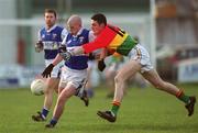 13 January 2002; Pauric Leonard of Laois in action against John McGrath of Carlow during the O'Byrne Cup semi-final match between Carlow and Laois at McCann Park in Portarlington, Laois. Photo by Damien Eagers/Sportsfile