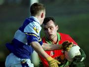 13 January 2002; Johnny Nevin of Carlow in action against Joseph Higgins of Laois during the O'Byrne Cup semi-final match between Carlow and Laois at McCann Park in Portarlington, Laois. Photo by Damien Eagers/Sportsfile