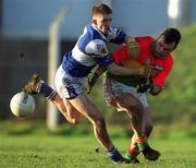 13 January 2002; Johnny Nevin of Carlow in action against Joseph Higgins of Laois during the O'Byrne Cup semi-final match between Carlow and Laois at McCann Park in Portarlington, Laois. Photo by Damien Eagers/Sportsfile