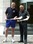 26 January 2002; Limerick's Brian Begley with local police Sargent Michael Camargo in Bunos Aires ahead of a training session prior to the Vodafone All Star tour at the Hurling Club of Argentina in Hurlingham, Buenos Aires, Argentina. Photo by Ray McManus/Sportsfile
