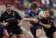 13 January 2002; Adam Magro of Leinster is tackled by Cedric Heymans of Toulouse during the  Heineken Cup Pool 6 Round 6 match between Toulouse and Leinster at Stade Les Sept Denier in Toulouse, France. Photo by Brendan Moran/Sportsfile