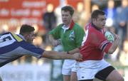 12 January 2002; Rob Henderson of Munster evades the tackle of Nicolas Spanghero of Castres during the Heineken Cup Pool 4 Round 6 match betweeen Castres and Munster at Stade Pierre Antoine in Castres, France. Photo by Brendan Moran/Sportsfile