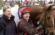 24 January 2002; Jockey, David Casey celebrates with trainer Charlie Swan, left, after winning  the IAWS Thyestes Handicap Steplechase with This is serious during racing at Gowran Park, Kilkenny. Photo by David Maher/Sportsfile