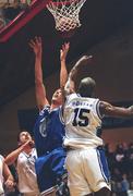 25 January 2002; Joe Malone of Waterford Crystal goes up for a basket despite the attentions of Marvin Dixon of SX3 Star during the ESB Men's National Cup semi-final between Waterford Crystal and SX3 Star at the ESB Arena in Tallaght, Dublin. Photo by Brian Lawless/Sportsfile