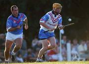26 January 2002; Eamon Corcoran of the 2001 Eircell Vodafone GAA All-Stars races clear of Johnny Dooley of the 2000 Eircell GAA All-Stars during the Vodafone All Star tour at the Hurling Club of Argentina in Hurlingham, Buenos Aires, Argentina. Photo by Ray McManus/Sportsfile