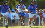 26 January 2002; Mark O'Leary of the 2001 Eircell Vodafone GAA All-Stars in action against Peter Barry, left, and Diarmuid O'Sullivan of the 2000 Eircell GAA All-Stars during the Vodafone All Star tour at the Hurling Club of Argentina in Hurlingham, Buenos Aires, Argentina. Photo by Ray McManus/Sportsfile