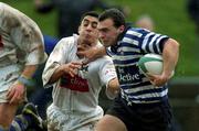 26 January 2002; Jim Ferris of Blackrock is tackled by Kieran Campbell of Dungannon during the AIB Rugby League Division 1 match between Dungannon and Blackrock at Stevenson Park in Tyrone. Photo by Damien Eagers/Sportsfile