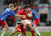 26 January 2002; David Wallace of Munster is tackled by Pierre Rabadan, 7, and Christophe Juillet of Stade Francais during the Heineken Cup Quarter Final match between Stade Francais and Munster at Stade Jean-Bouin in Paris, France. Photo by Matt Browne/Sportsfile