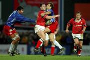 26 January 2002; David Wallace of Munster is tackled by the Stade Francais defence during the Heineken Cup Quarter Final match between Stade Francais and Munster at Stade Jean-Bouin in Paris, France. Photo by Matt Browne/Sportsfile